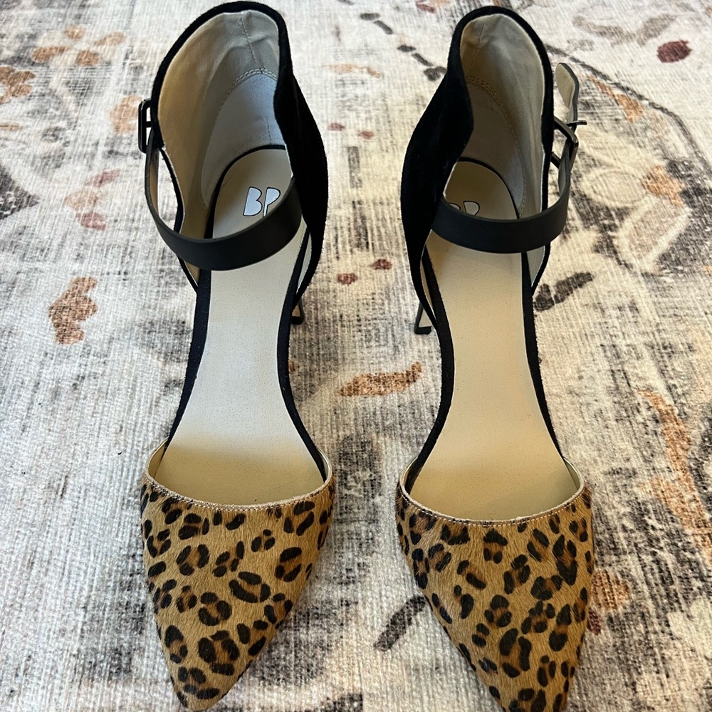 Cute real calf hair and suede leopard and black heels.